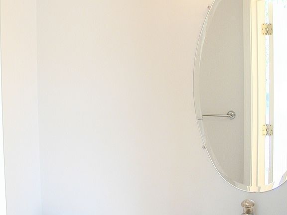 First floor powder room adjacent to foyer