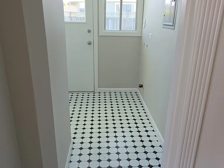 Storage area and panty closet outside of kitchen