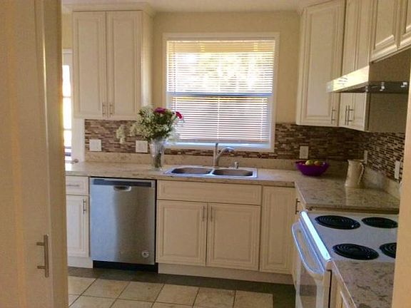 Brand new kitchen remodel with some new appliances and a new ceramic tile floor. Stove and refrigerator included.