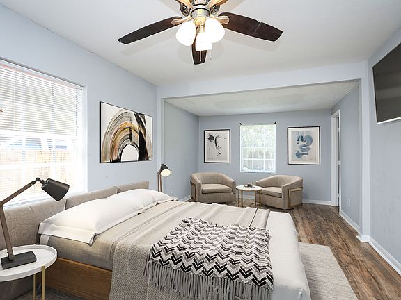 HUGE Primary Bedroom (staged) with sitting area and en suite bath.