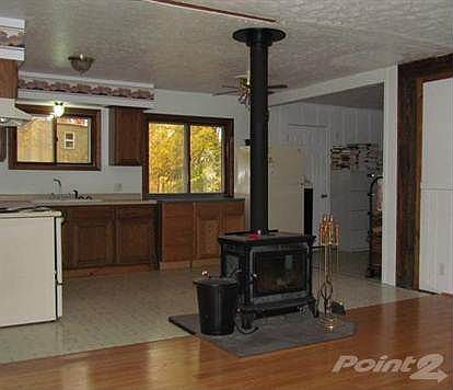 Open floor plan with wood floors and open kitchen.