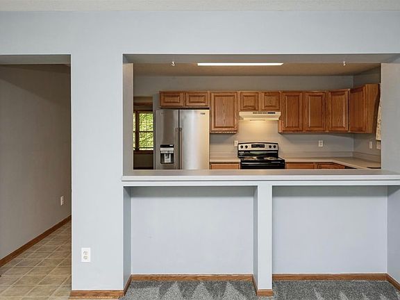 We love the open concept between the living room and kitchen that's perfect for some bar stools and setting up snacks for gatherings. Imagine your family and friends gathered in this space, spending time together while a delicious meal is being prepared!