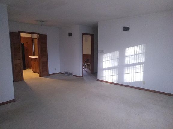 Living room looking towards kitchen and hallway