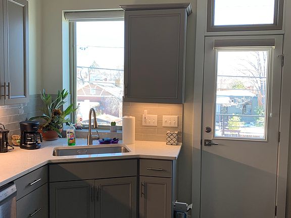 Back Entrance and part of the kitchen which has new appliances and quartz countertops