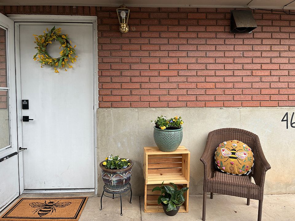 Adorable front porch - convenient ground level entrance just steps away from driveway parking.