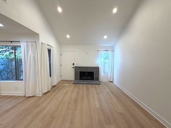 Fireplace view from living room. Plug above fireplace for flatscreen TV.