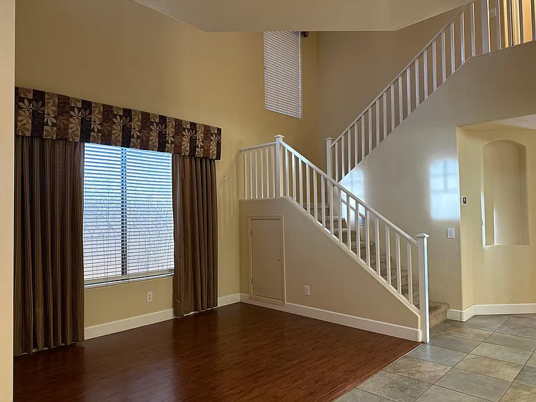 Entry with formal living room with lots of light. All windows have 90-95% sun blockage for all screens for extra energy savings, which can also be removed for additional light.