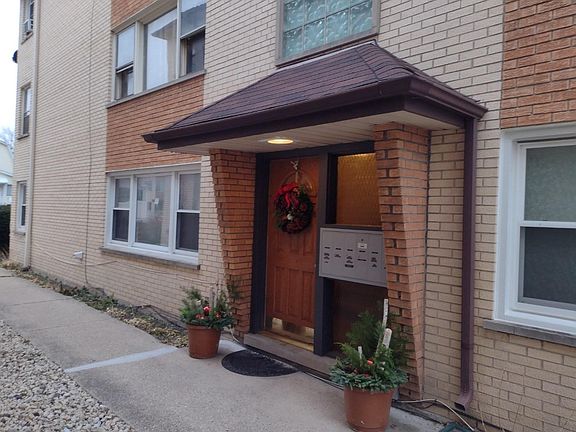 Front door, mailbox and doorbell