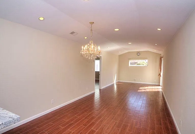 Dining/Living room: Kitchen opens up into a spacious dining and living room area. Sliding doors that open up to the backyard.