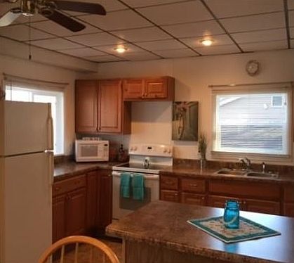 Enjoy the modern amenities and classic cabin tradition.  Bright open kitchen with Breakfast Bar and dining area