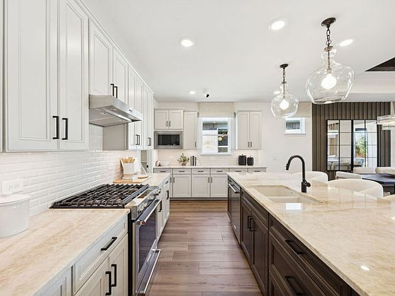 Recessed and pendant lighting in kitchen