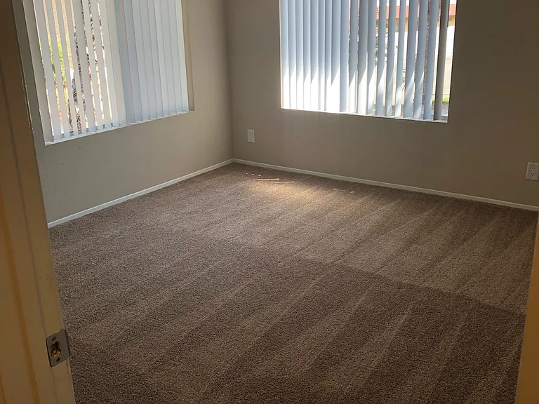Large bedroom with lots of natural light at Grande Vista Apartments.