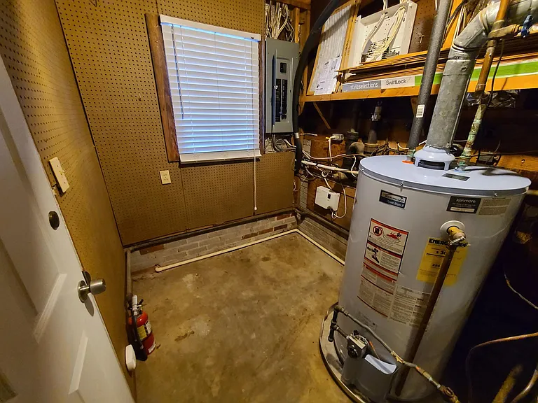 The peg board walls in the utility room are a great place to hang your tools.