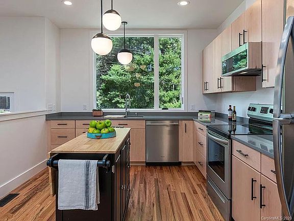 Custom kitchen with quartz counters (stand alone island not included)