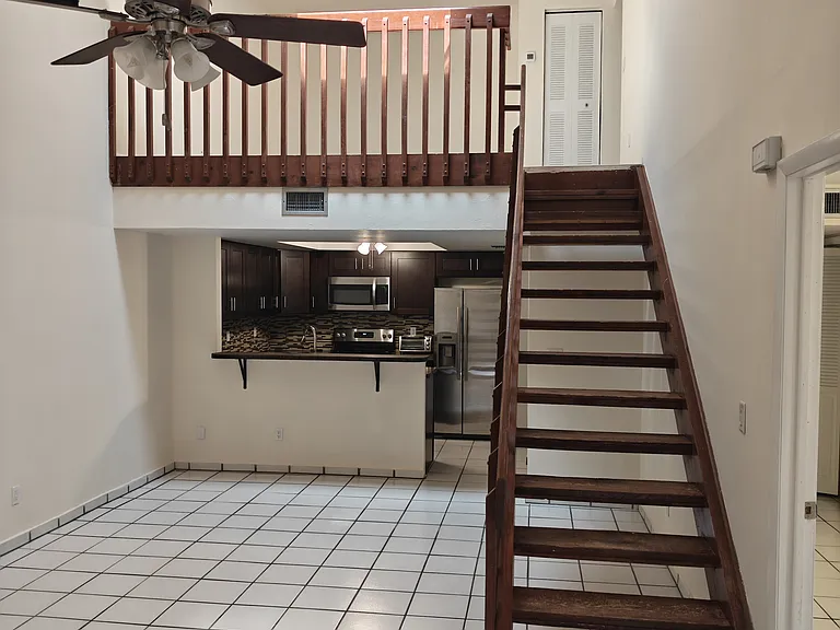 1st and 2nd floor living area, and kitchen. 1st Floor bedroom on the right, patio on the right
