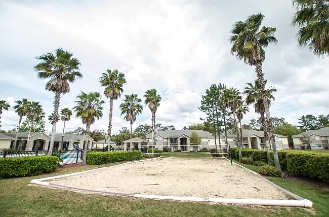 Beach volleyball court; pool to the left