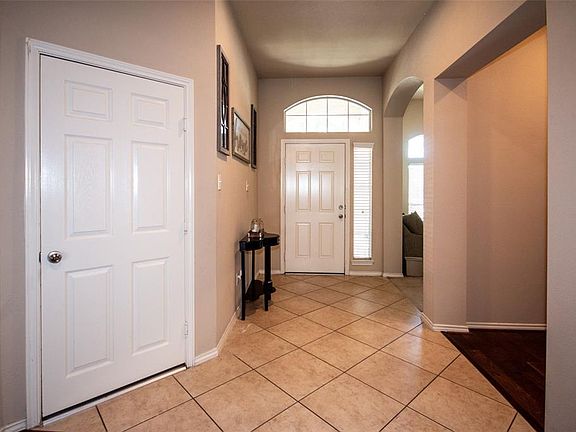 open door and close it large foyer and door to left is garage