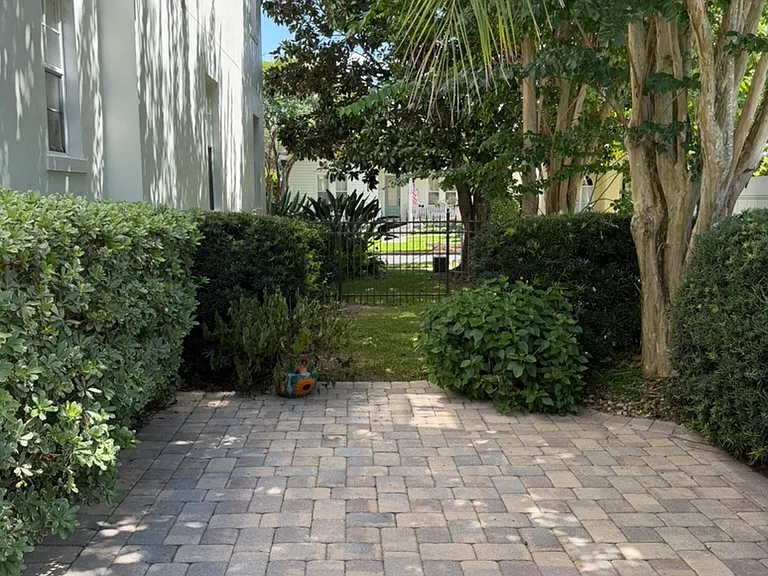 Side Yard with pavers and grassy area, all fenced