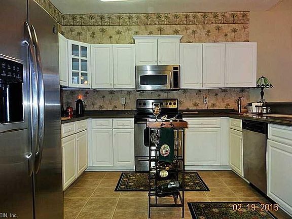 Kitchen with corian counters and LOTS of cabinets!