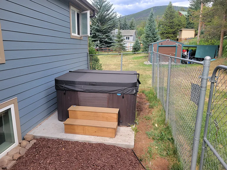 Hot tub and fenced-in pet area