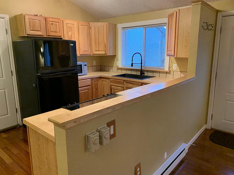 Remodeled kitchen with farmhouse deep sink