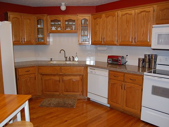 Kitchen with updated granite counters and sink.