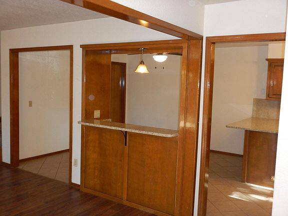 VIEW OF PASS-THROUGH FROM KITCHEN TO LIVING ROOM