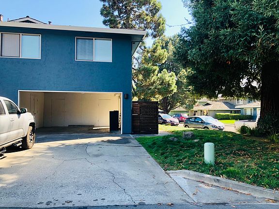 You get one covered space and can park a second car behind the first in the driveway. Also included are two lockable storage areas in the carport.