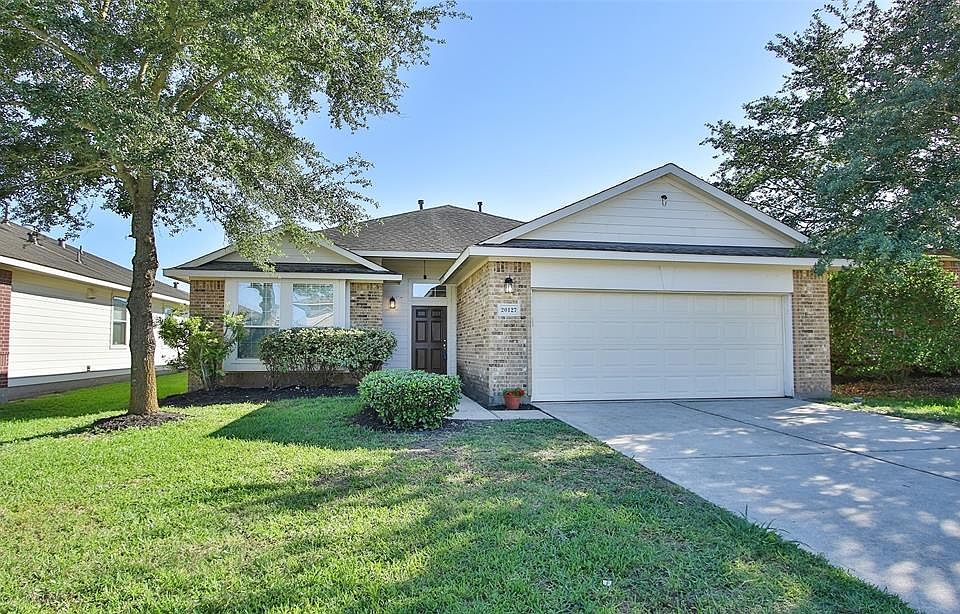 Welcome to 20127 Enchanted Rose Lane, the perfect place to call home!