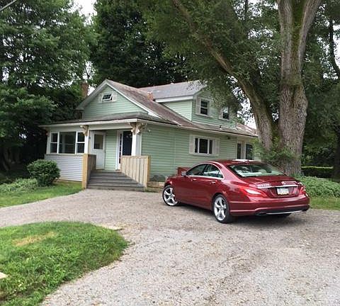 Private Drive on country paved road with adjacent off street