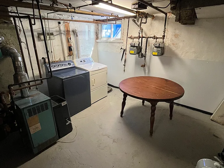 Laundry room in unit with space for storage