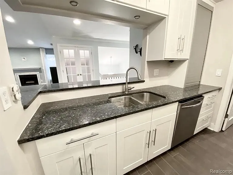 Custom IKEA Kitchen. Soft-close drawers and cabinets. Norway Blue Pearl Granite Countertop.