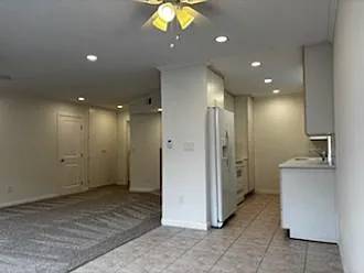 View from dining area into kitchen and living room - 3852 Basilone St #2