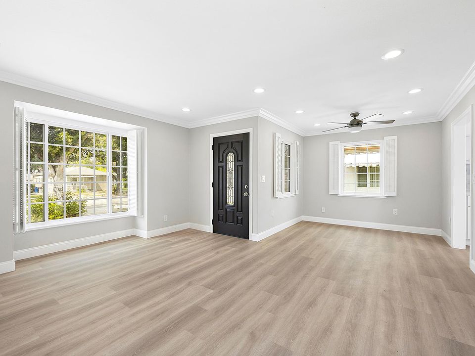 Spacious living room and dining room, filled with lights!