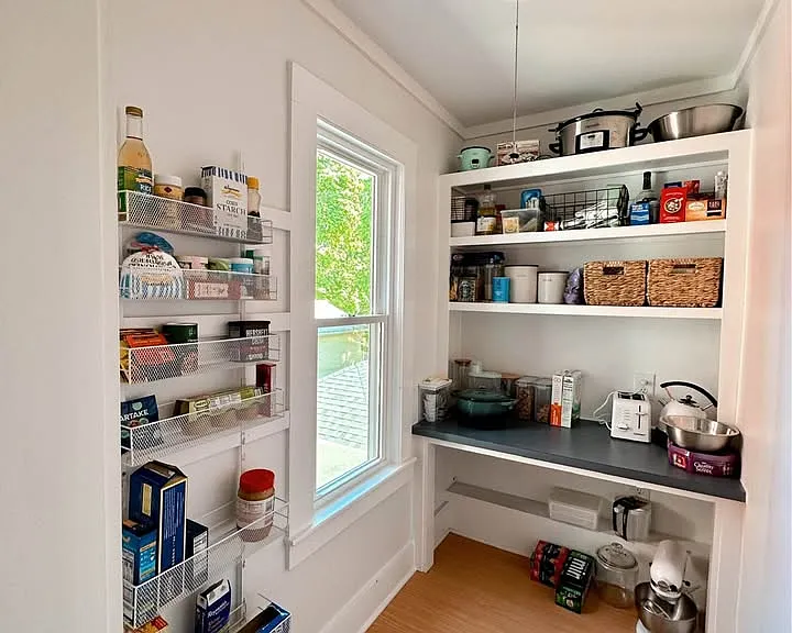 The pantry is bright and open with tons of space for storage.