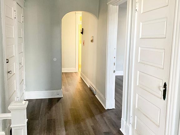 Hallway with two large storage closets