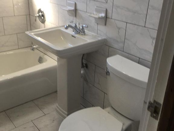 Full bath -all tiled - neutral color