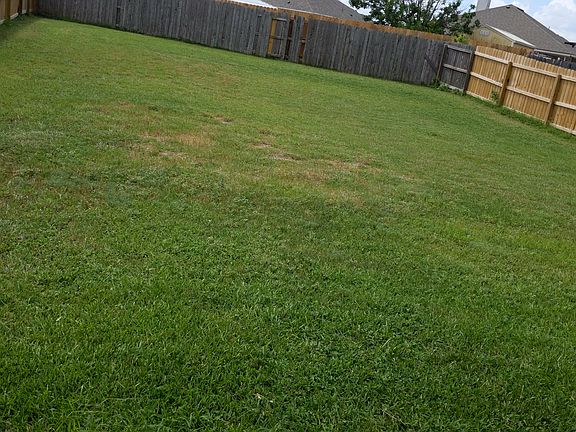 Large backyard offering a playground