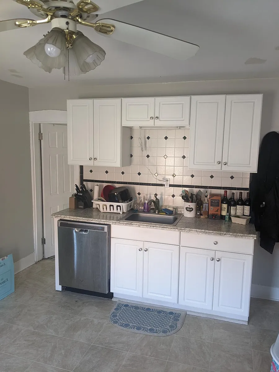 Photo 2 of 9 - 55 E Central St #2 - Natick, MA White cabinets and dishwasher - 55 E Central St #2