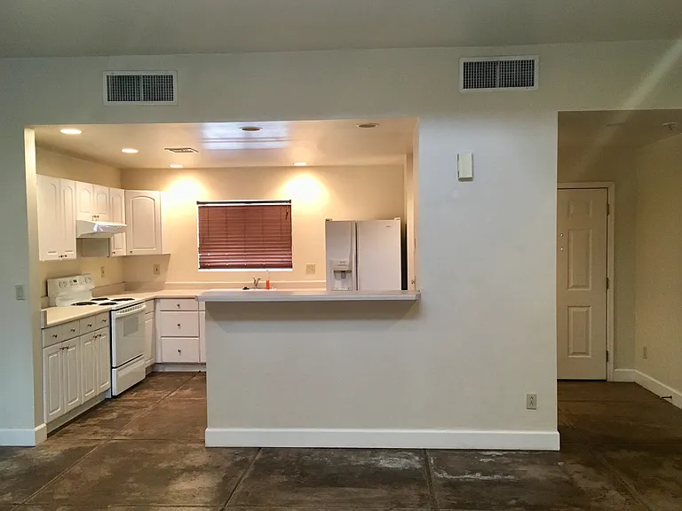 Kitchen and front door viewed from great room