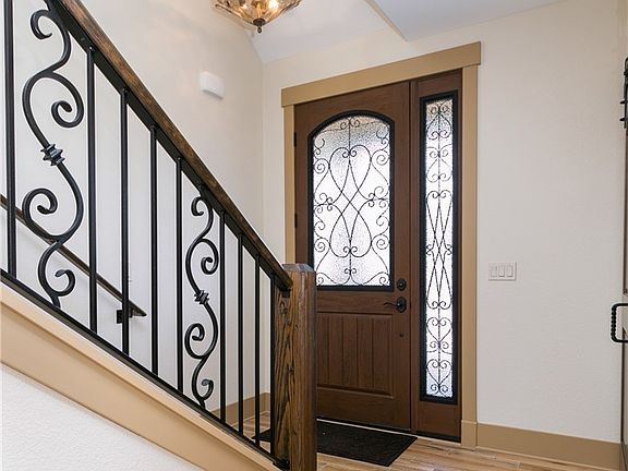 Entryway opens up into office and kitchen