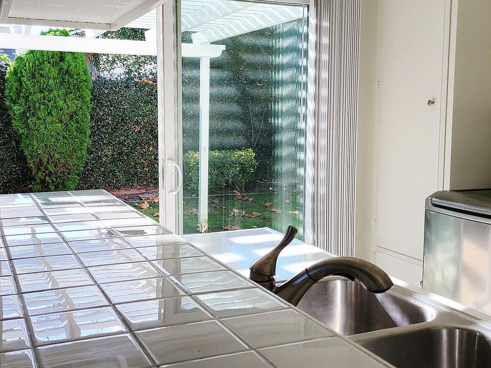 Kitchen and sliding door to private back yard.
