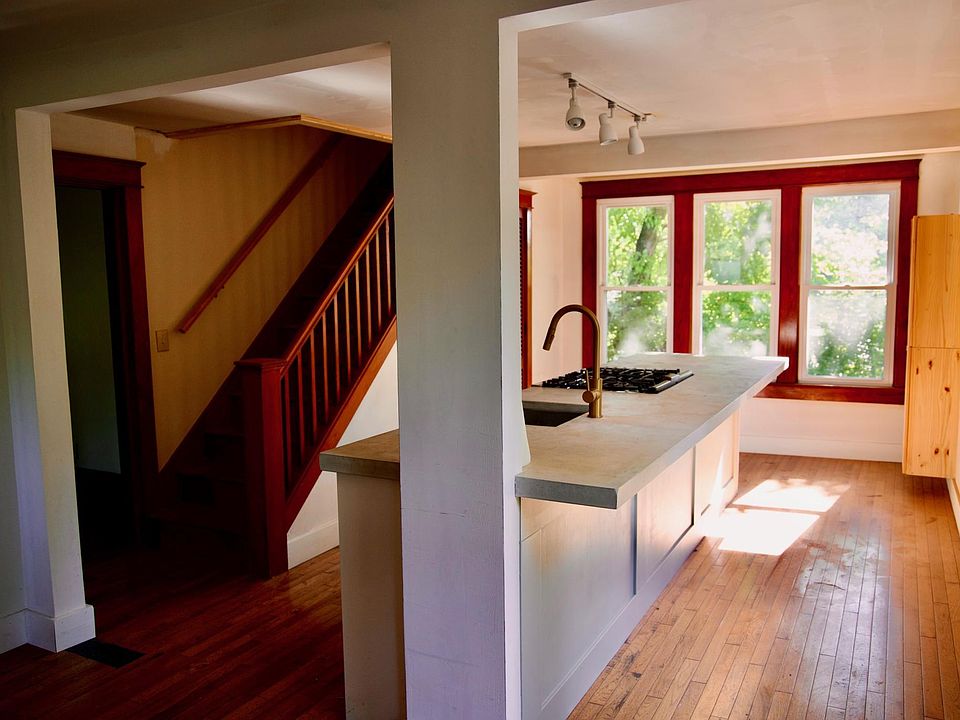 Kitchen and stairs to primary bedroom.