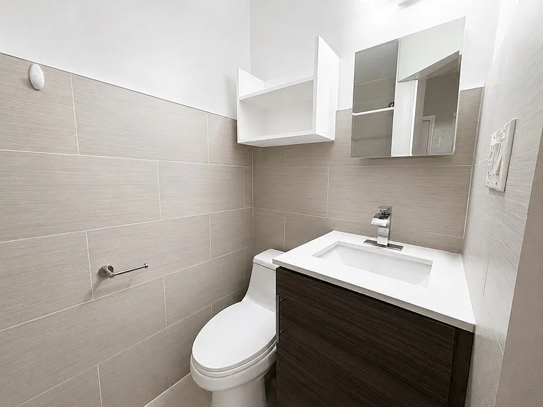 16 - Bathroom 2 - Vanity, Toilet, and Wall Storage