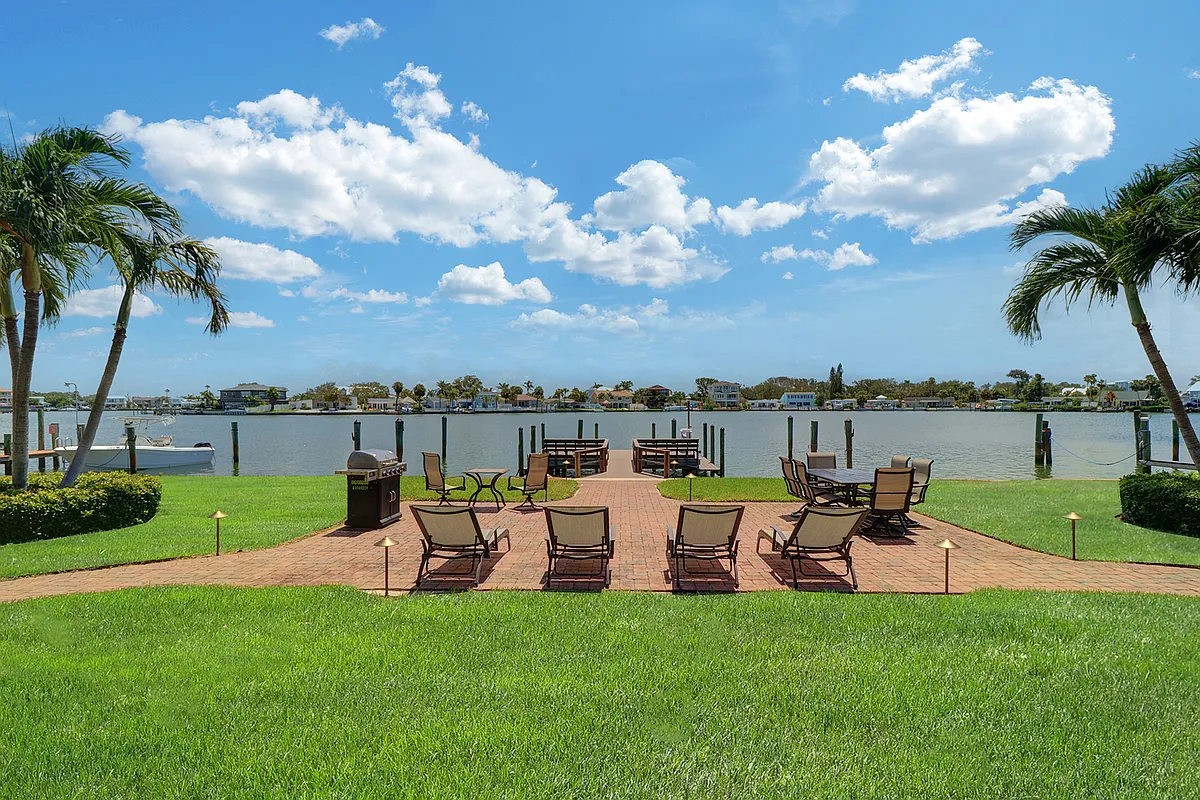Common patio has BBQ grill, stylish furnishings and decorative landscape light fixtures - 2207 Bay Blvd #205