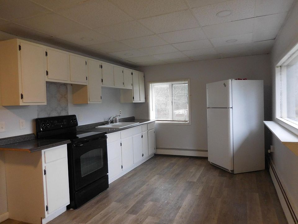 Kitchen with stove and refrigerator