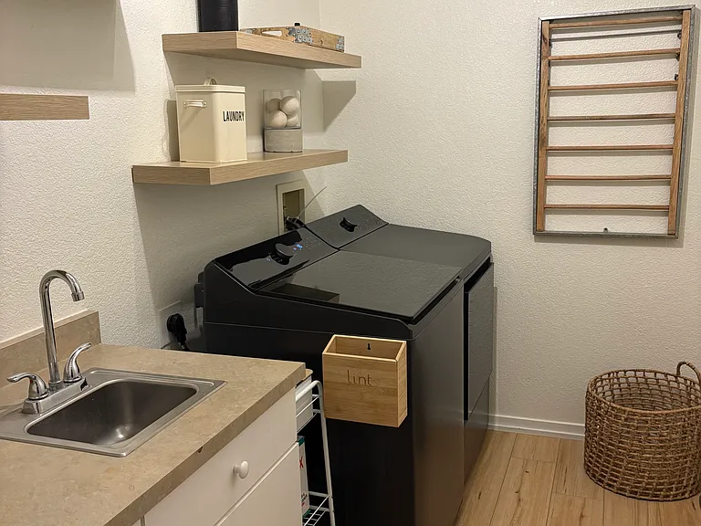 Laundry room with brand new high capacity washer and dryer