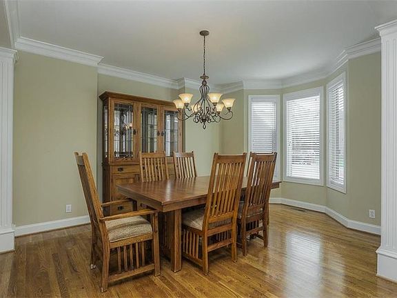 The formal dining room easily seats ten.