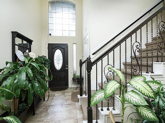 The entry features high ceiling and the big windows provide lots of light