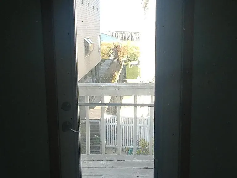 View of bay and bridge from primary bedroom balcony